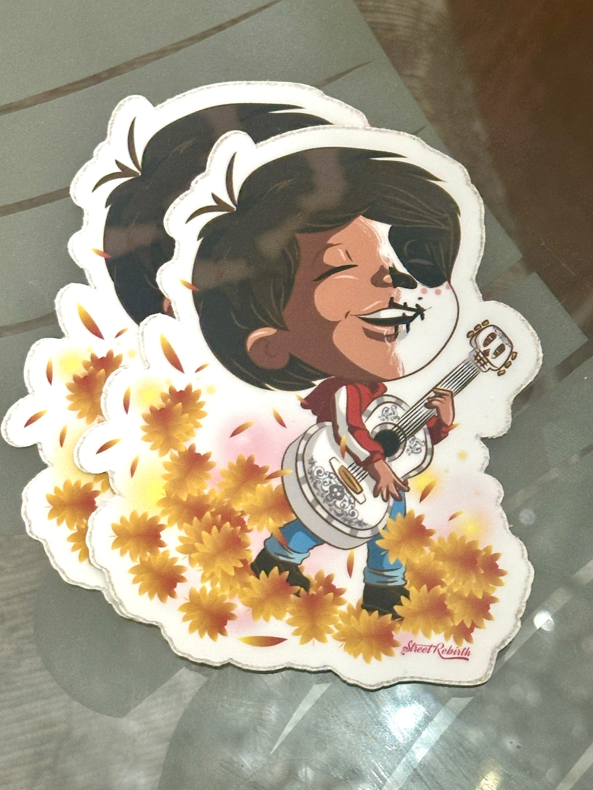 Miguel Half-Face Painted Sticker – Día de los Muertos Inspired Art | Guitar Player Surrounded by Autumn Leaves | Remember Me Aesthetic Decal