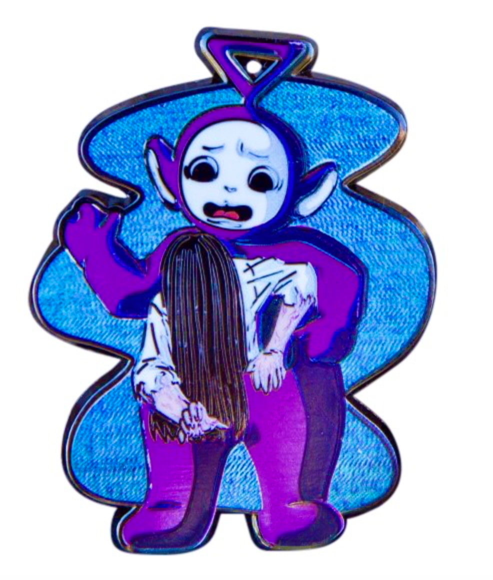 The Ring Girl Emerging from a Teletubby Enamel Pin – A Darkly Creative Mashup