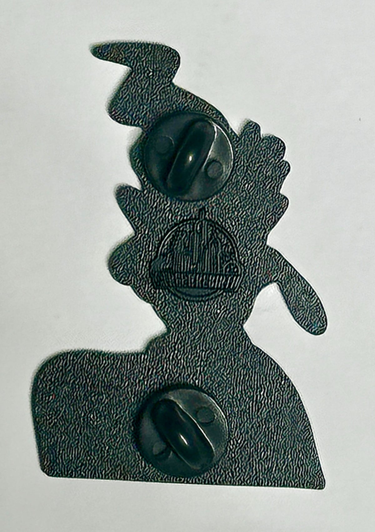 black metal two-post backing of 90s cartoon mashup enamel pin