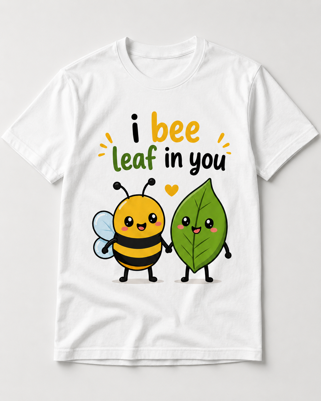 I Bee Leaf In You cute bee and leaf love pun graphic tee on a white shirt