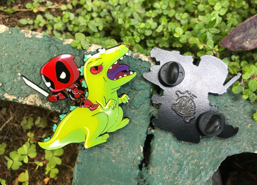 Masked hero riding bright green cartoon dinosaur enamel pin front and back view