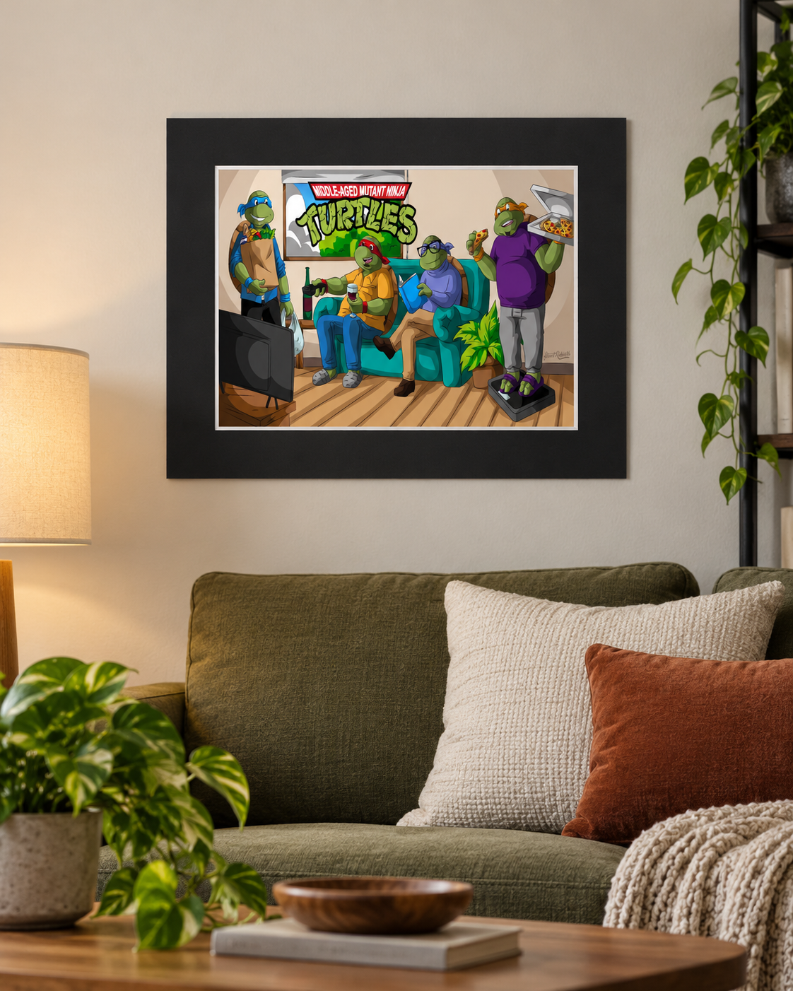 16x20 horizontal black-matted cartoon turtle wall art hanging over a green sofa in a modern living room