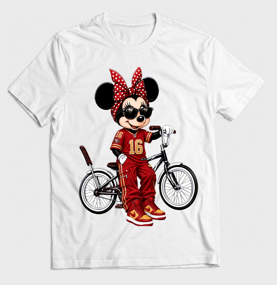 White graphic T-shirt featuring a cartoon mouse in a red and gold football outfit with a polka dot bow and lowrider bicycle