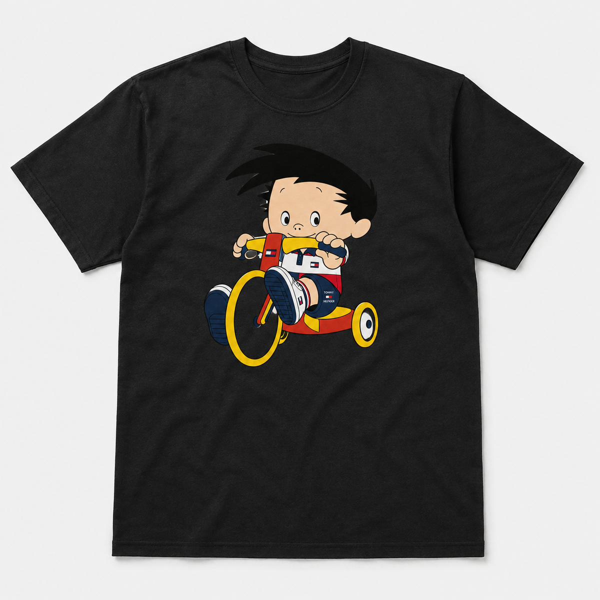 Black graphic T-shirt with retro cartoon child riding a colorful tricycle illustration