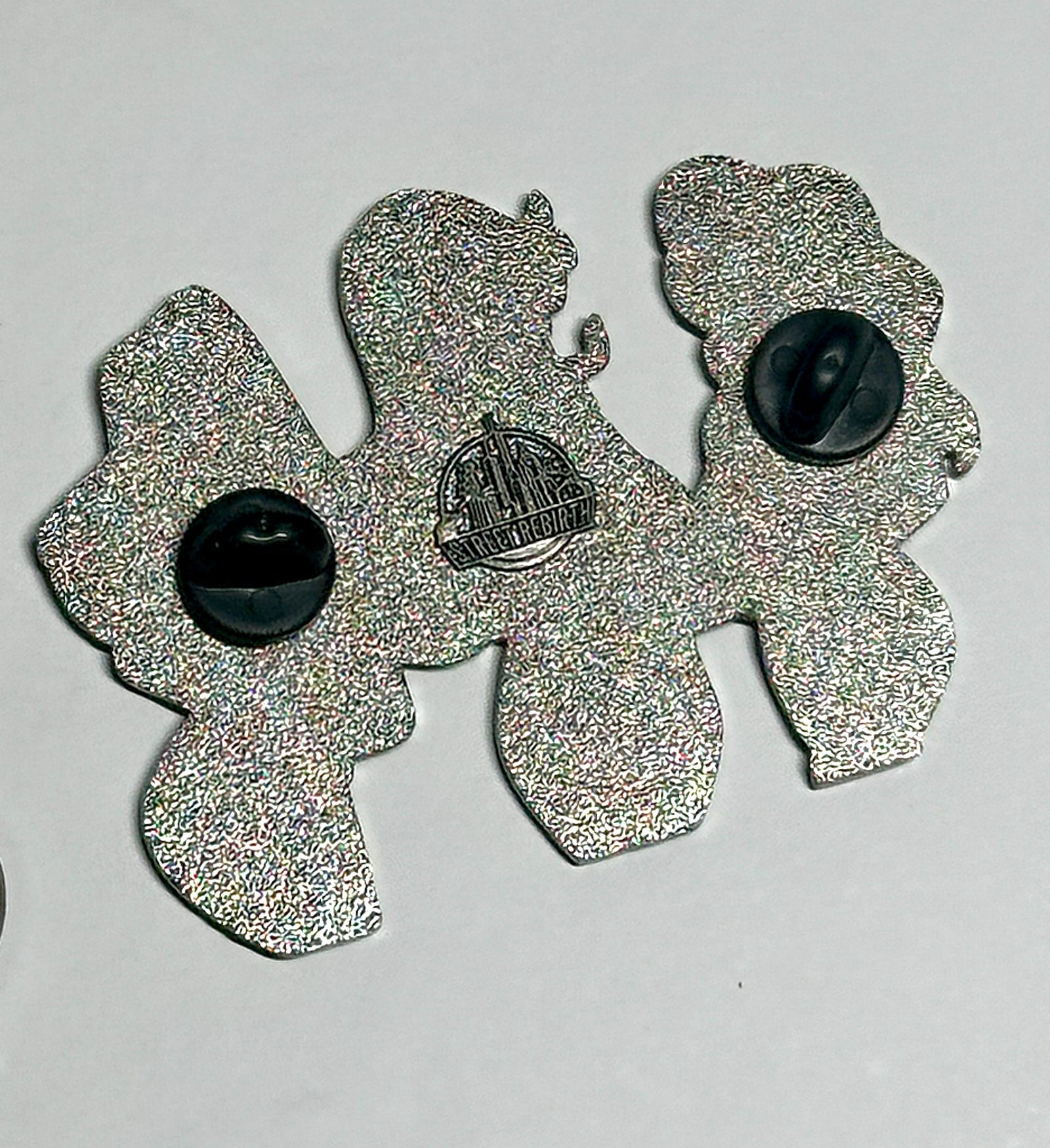 silver metal two-post backing of triple character mashup enamel pin