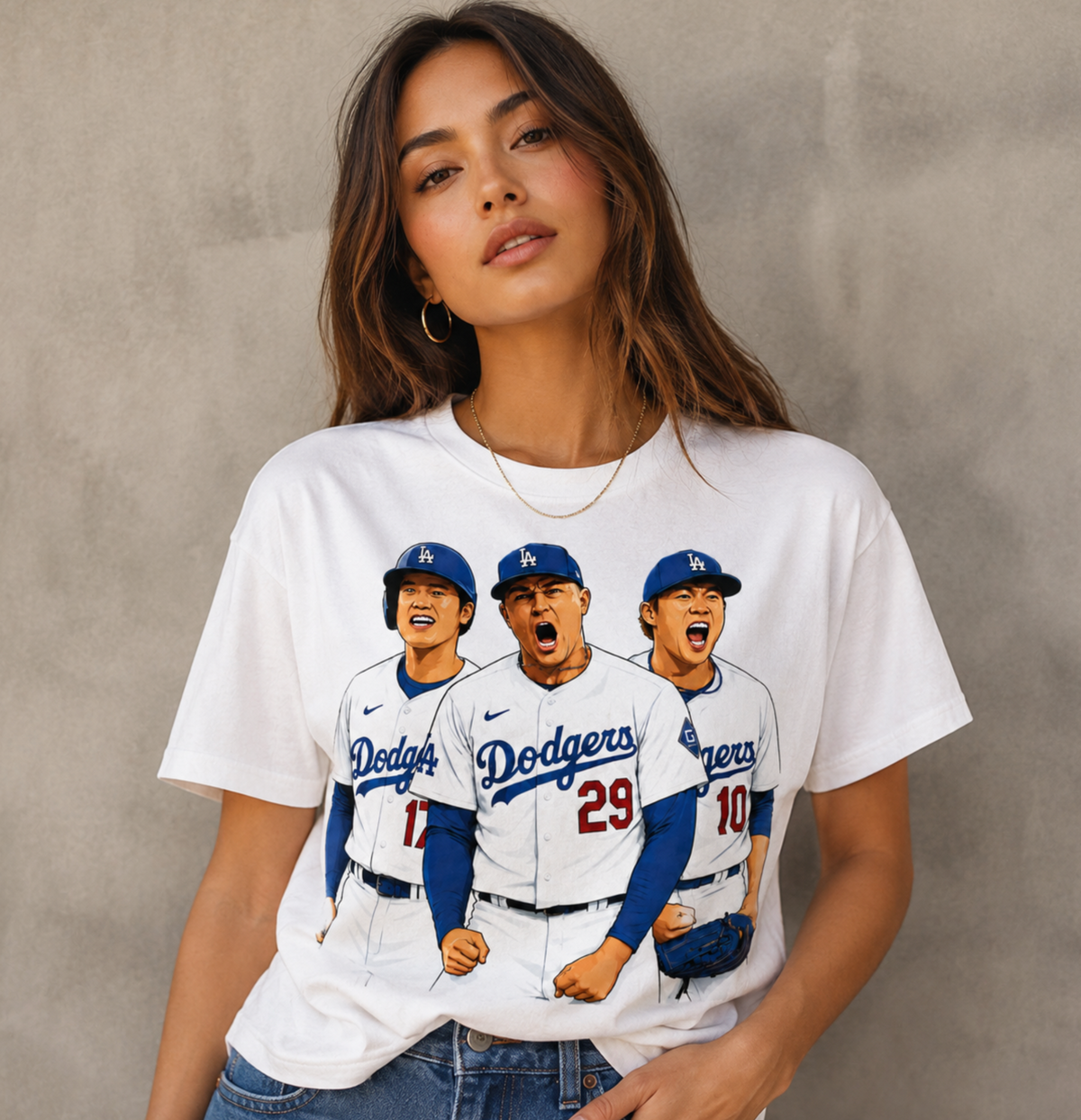 Female model wearing a white baseball trio graphic T shirt with a relaxed streetwear fit.