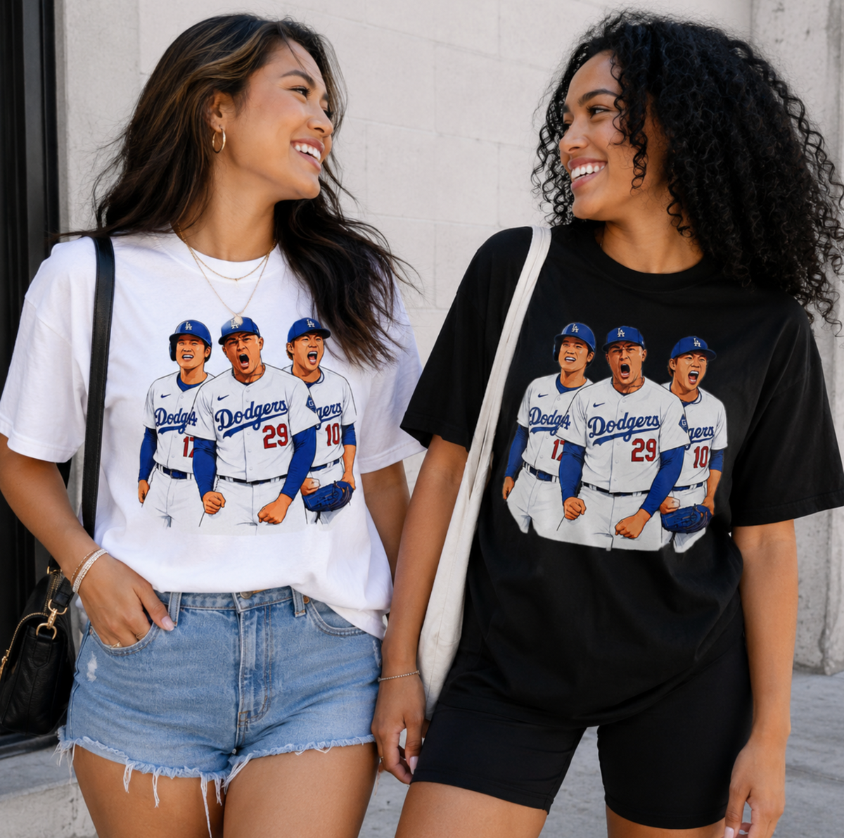 Two female models wearing white and black versions of the baseball trio graphic T shirt.