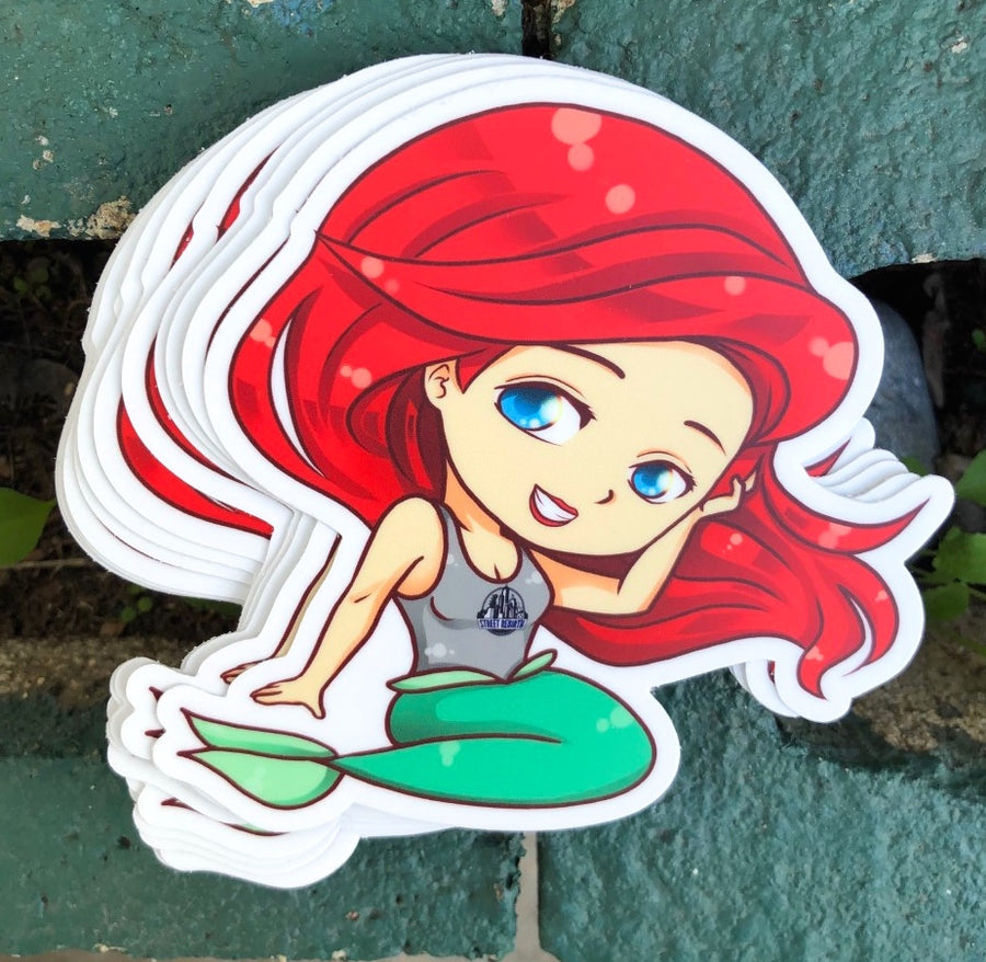 Chibi mermaid with red hair in modern casual streetwear, cute fantasy sticker art