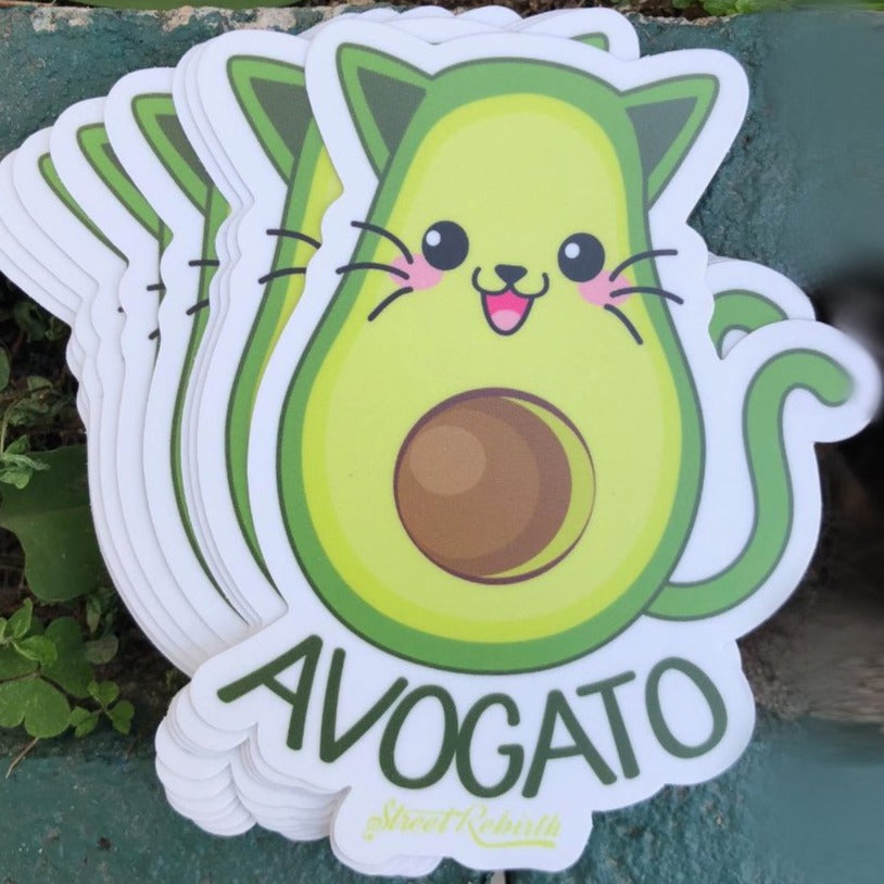 Avogato sticker with a cartoon cat shaped like a ripe avocado, a funny avocado cat pun design