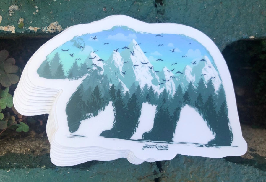 Abstract bear silhouette sticker with a forest landscape inside the shape