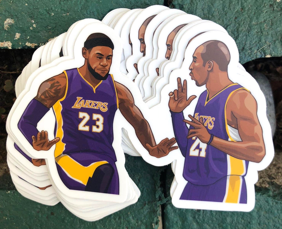 Two basketball legends in purple and gold running a court strategy, sticker art
